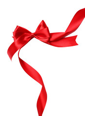 Shiny red satin ribbon and bow isolated on white