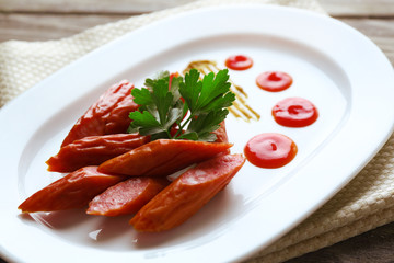 Smoked thin sausages and vegetables