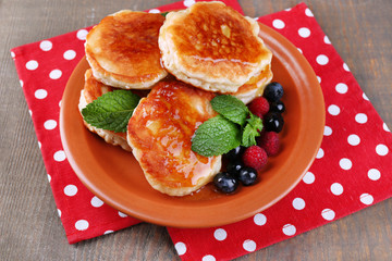Tasty pancakes with fresh berries, honey and mint leaf
