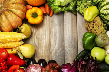 Fresh organic vegetables on wooden table, close up