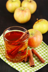 Apple cider with cinnamon sticks and fresh apples