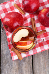 Apple cider with cinnamon sticks and fresh apples