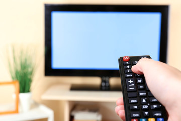 Watching TV and using remote controller
