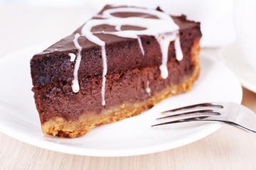 Piece of chocolate cake on plate closeup