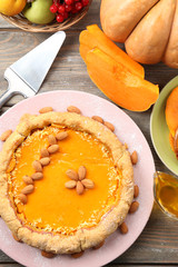 Homemade pumpkin pie on table