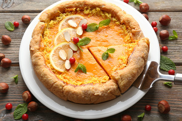 Homemade pumpkin pie on table