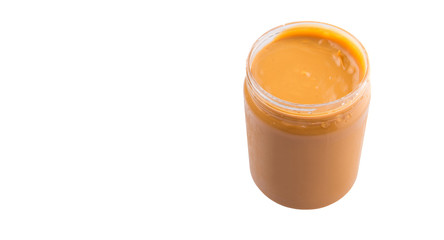 Peanut butter in a jar over white background