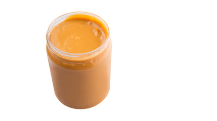 Peanut butter in a jar over white background