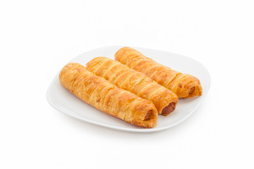 croissant hotdog roll on dish,isolated