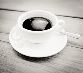 Black and white coffee cup on wood table