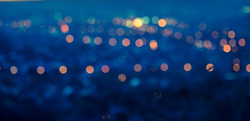 city blurring lights abstract circular bokeh blue background wit