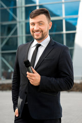 Portrait of well-dressed man on the contempopary background