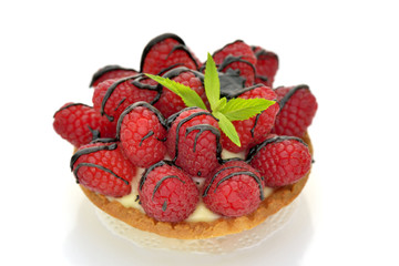 Raspberry tartlet on white background