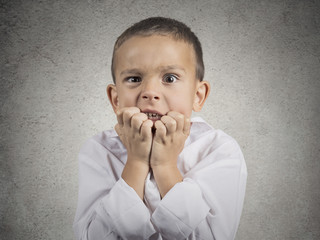 nervous anxious stressed child boy biting fingernails