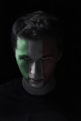 serios man face with painted flag colors of Italy