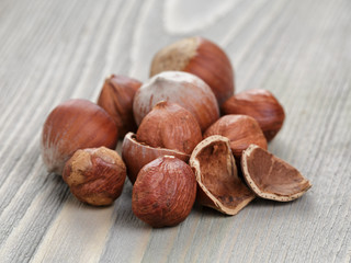 close up open and whole hazelnuts