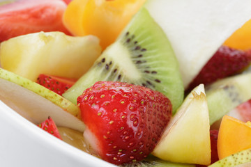 fresh mix fruit salad with strawberry, kiwi and peach