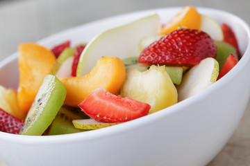 fresh mix fruit salad with strawberry, kiwi and peach
