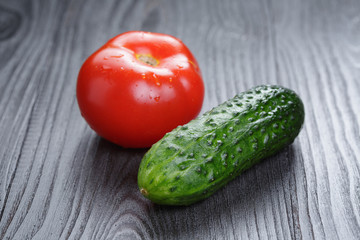 tomato and cucumber on black wood table