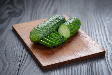 sliced cucumber on cutting board