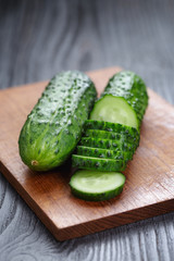 sliced cucumber on cutting board