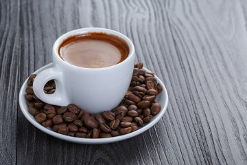 cup of fresh espresso with beans