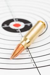 Rifle bullet over target background