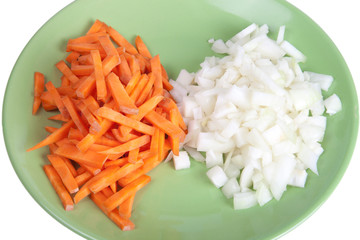 Carrot and onion on a plate isolated on a white background