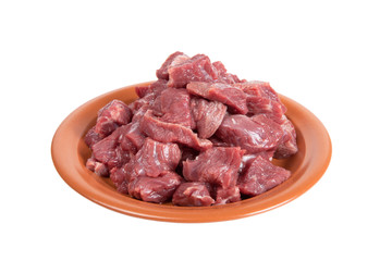 Pieces of beef on a plate isolated on white background