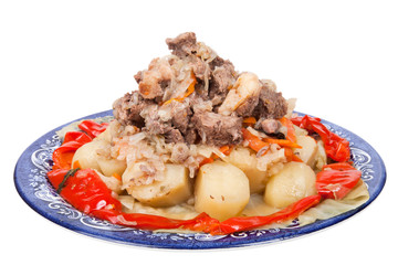 Stew with potatoes sweet pepper on a plate isolated on white bac