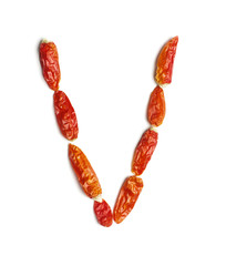 Alphabet letter V arranged from chili peppers isolated