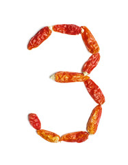 Number 3 arranged from chili peppers isolated