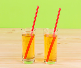 Apple juice on wooden table.