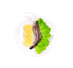 Raw tiger shrimps on plate.