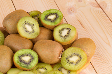 Kiwi fruits cut and whole. Close up.