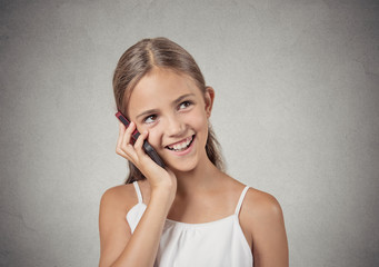 happy teenager girl talking on smartphone grey background 