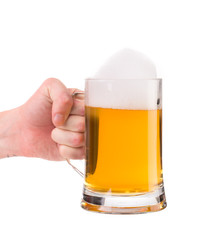 Hand holding mug of beer.