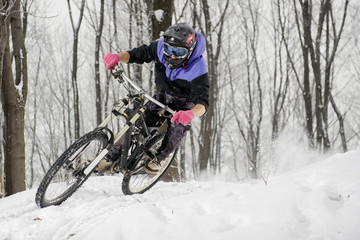 mountainbiker in winter - obrazy, fototapety, plakaty