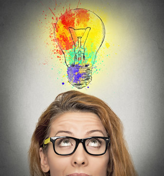 woman having brilliant idea colorful lightbulb above head 
