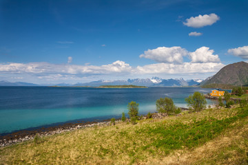 scenic view of fjord, snow mountains and house, Norway, Lofoten