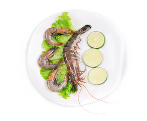 Shrimps with sliced lime.