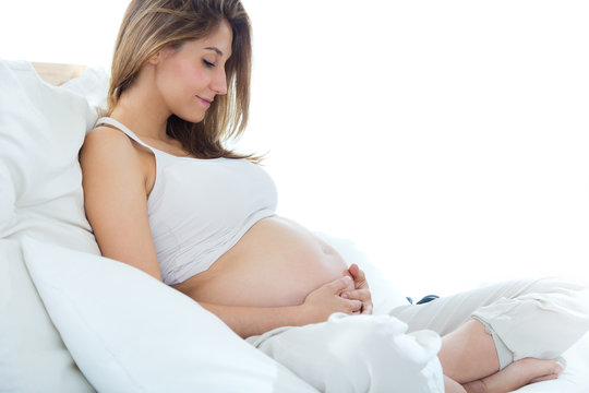 Pregnant woman relaxing at home.