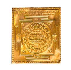 Golden yantra on white.Manufactured from copper plate