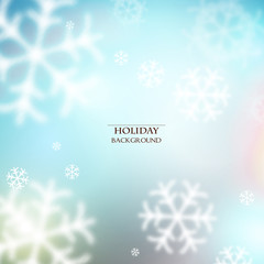 White defocused snowflakes on glow background. Christmas abstrac