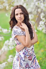 Fototapeta premium Portrait of the young beautiful smiling woman outdoors