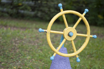 old steering wheel on the playground