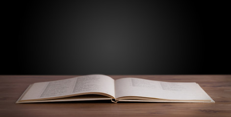 Open book on wooden deck