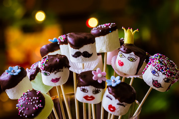 Funny marshmallow pops with chocolate hair