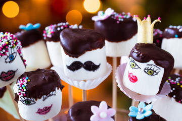 Funny marshmallow pops with chocolate hair