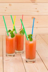 Grapefruit juice on table.